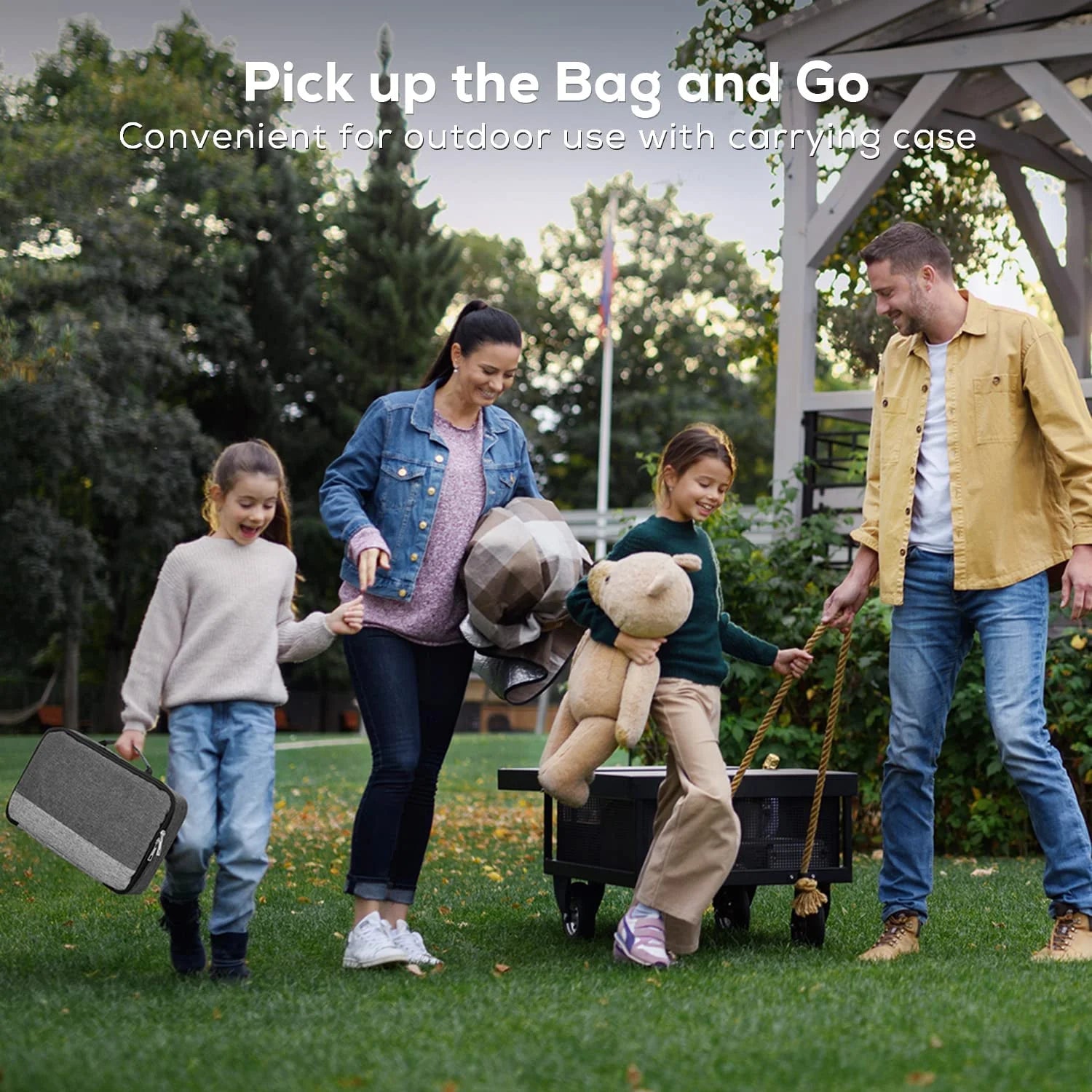 Family carrying the Portable  projector in its convenient carrying case with the text 'Pick up the bag and go' and 'Convenient for outdoor use with carrying case.